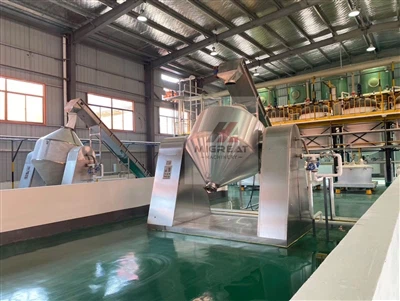 What is the working principle of a vacuum belt dryer